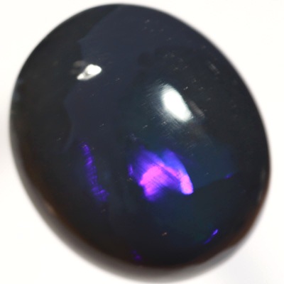 SOLID BLACK OPAL Huge opal with rolling flashes of electric blue. SEE VIDEO
